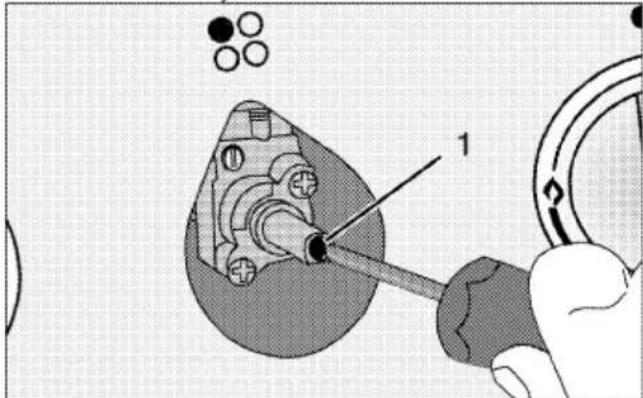 Technical diagram showing a mechanical assembly with labeled component '1' and circular components, likely illustrating a tool or procedure.