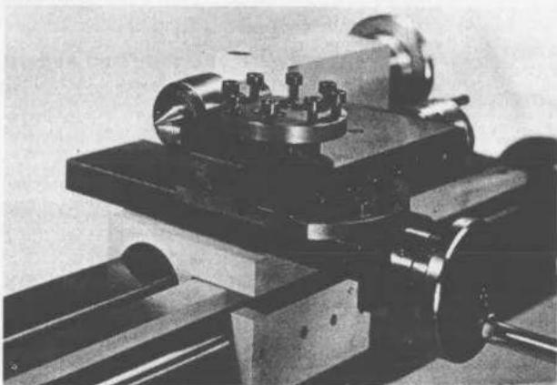 Close-up of a mechanical optical setup with lenses and a rotating shaft (no visible text or symbols)