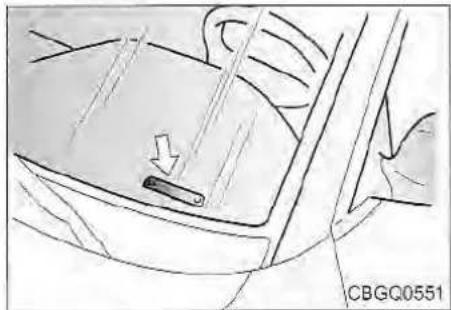 Diagram of a car interior showing a handle and seat, with no visible text or symbols
