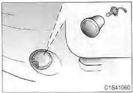 Diagram of a car interior showing a wheel, dashboard, and exhaust pipe (no text or symbols)