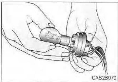Illustration of hands holding a mechanical component with wires, no visible text or symbols