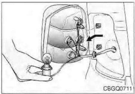 Illustration of a hand holding a light bulb connected to a car's side panel, with an arrow indicating the cable direction (no text or symbols present)