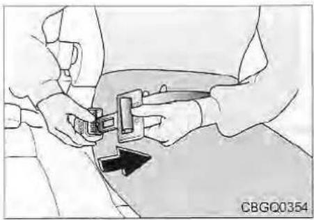 Illustration of a person adjusting a seatbelt with a black arrow indicating direction (no text or symbols)