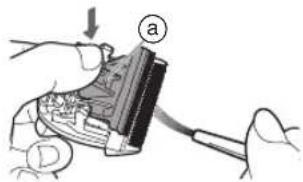 Diagram showing a hand holding a device with labeled parts and an arrow indicating direction, likely illustrating a process or assembly.