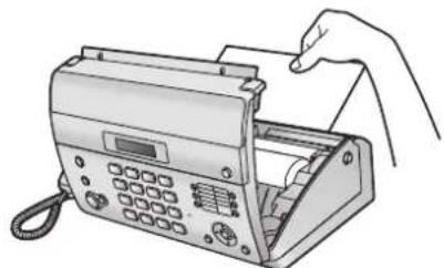 Line drawing of a hand inserting a card into a digital telephone (no text or symbols visible)