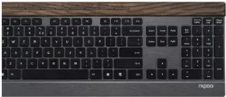 Close-up of a black computer keyboard with standard keys and a blue mouse (no visible text or symbols on the keys themselves)