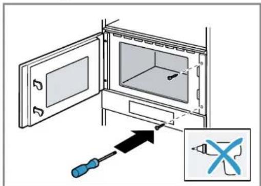 Diagram showing a screwdriver inserted into a microwave oven with a magnified inset highlighting the tool's cross symbol.