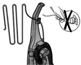 Illustration of a hairpin with coiled cord and a magnified inset showing a pair of scissors (no text or symbols).