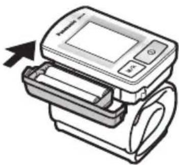 Illustration d'un tensiomètre numérique avec une flèche indiquant une action de compression (aucun texte ni symbole présent)