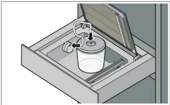 Diagram of a mechanical device with a cylindrical container and tubing, showing internal components (no text or symbols)