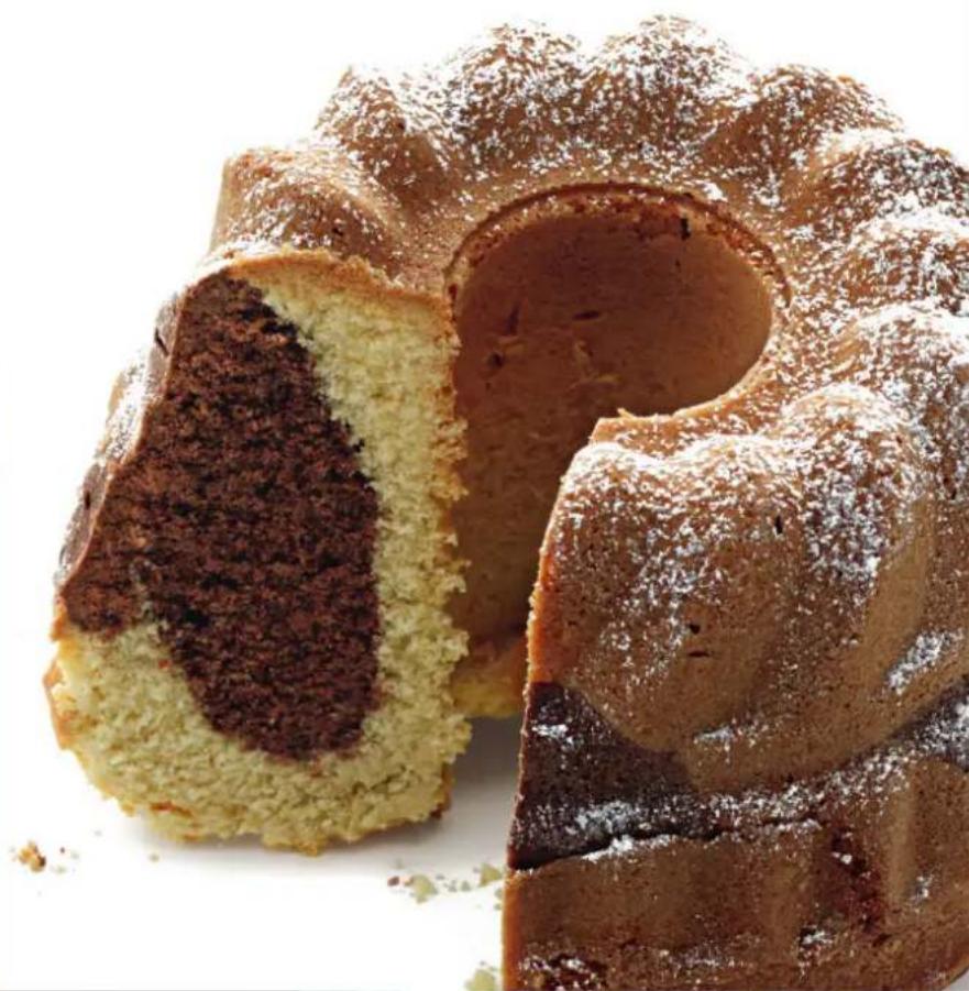 Close-up of a chocolate cake with powdered sugar, showing its interior and exterior slices (no text or symbols visible).