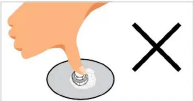 Illustration of a hand pressing down on a circular button with a cross symbol nearby (no text or labels)