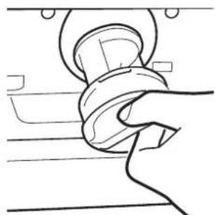 Line drawing of a mechanical component with a coiled spring and housing (no text or symbols).