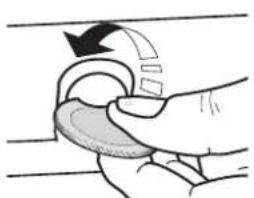 Hand holding a circular object with an arrow indicating rotation (no text or symbols)