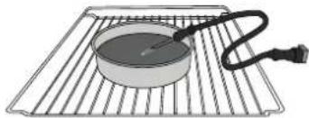 Illustration of a cooking pan on a cooling rack with a cord (no text or symbols)
