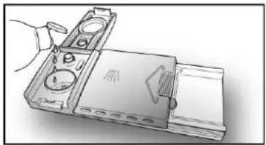 Illustration of a hand holding a device with a lid and ports, no visible text or symbols.