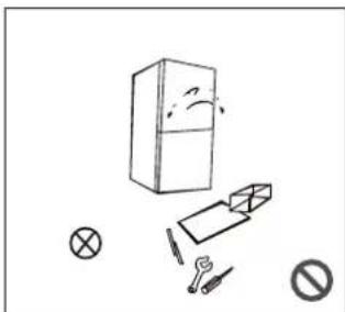 Simple line drawing of a refrigerator, battery, switch, and prohibition symbol (no text or labels)