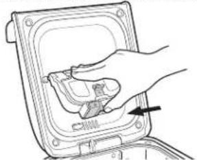 Hand placing a component into a device casing (no text or symbols visible)