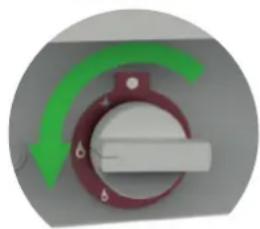 Close-up of a rotary switch with green and gray curved arrows indicating direction (no text or symbols)