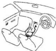 Dessin au trait d'un intérieur de voiture montrant le tableau de bord, la ceinture de sécurité et le volant (pas de texte ni de symboles)
