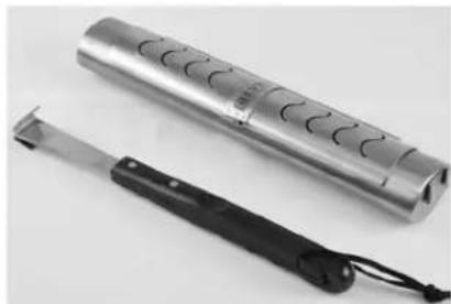 Two electronic devices: a silver cylindrical device with circular cutouts and a black-handled tool with attached strap, no visible text or symbols.