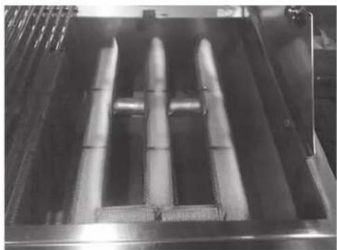 Industrial machine with three vertical cylindrical components mounted on a metal frame (no visible text or symbols)
