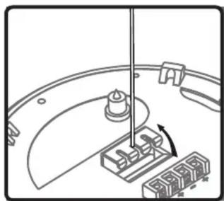 Mechanical assembly diagram showing a rotating component with a shaft and base blocks (no text or symbols)