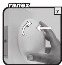 Hand holding a white circular object with an arrow indicating rotation (no text or symbols)