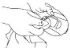 Line drawing of a hand holding an object, possibly a tool or device (no text or symbols present)