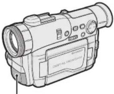 Line drawing of a digital video camera with lens and control panel (no text or symbols)