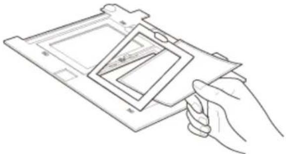 Line drawing of a hand holding a small electronic device with a grid-like structure.