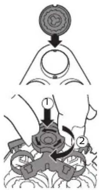 Diagram illustrating a mechanical assembly or disassembly process with labeled steps 1 and 2, showing a circular component being inserted into a ring.