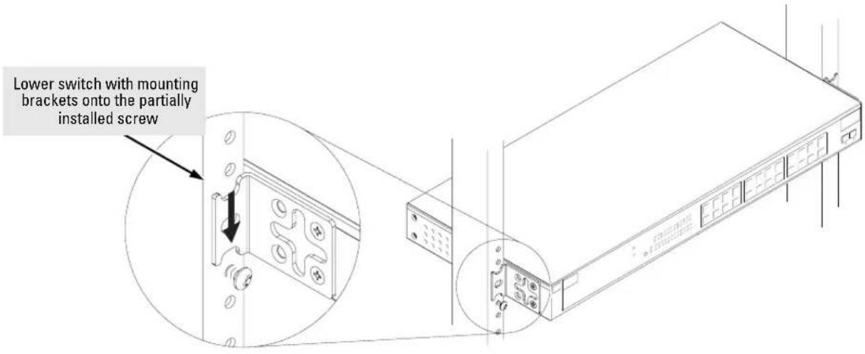 Lower switch with mounting brackets onto the partially installed screw