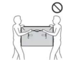 Illustration of two human figures holding a large object with a 'no' symbol above them (no text or labels).