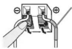 Diagram of a hand inserting or adjusting a plug into a socket (no text or symbols visible)