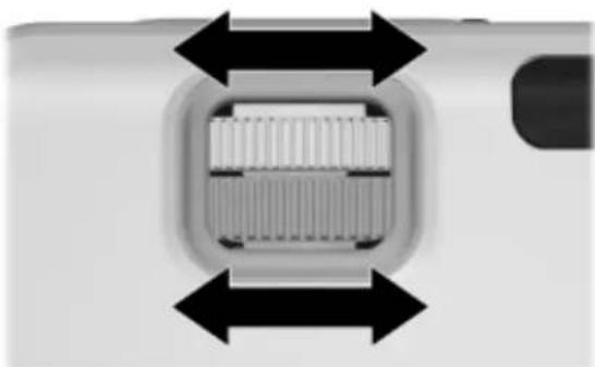 Close-up of a camera lens with bidirectional arrows indicating measurement or alignment (no text or symbols).