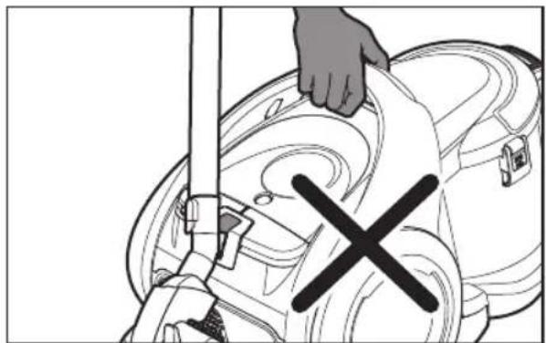 Illustration of a hand using a tool to clean or repair a machine component, with no visible text or symbols.
