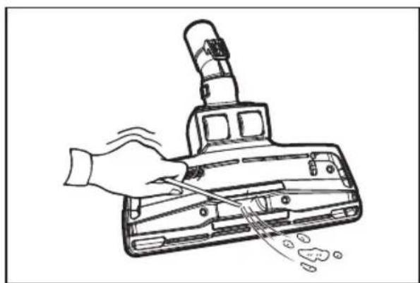 Line drawing of a hand using a tool to clean or brush the power of a mechanical device (no text or symbols)