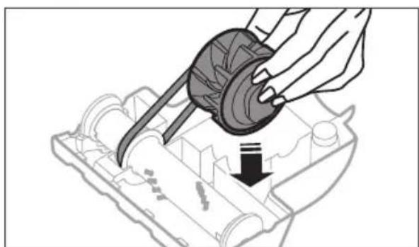Illustration of a hand using a tool to adjust or install a mechanical component, with no visible text or symbols.