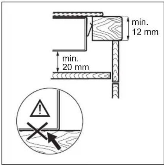 Illustration of a hand holding a pen above an open book, with a magnified inset showing the tip of the pen (no text or symbols present)