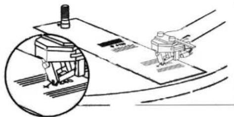 Technical illustration of a mechanical assembly with a magnified inset showing internal components (no text or symbols)
