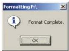 Formatting dialog box for drive F: with message 'Format Complete.' and an 'OK' button.