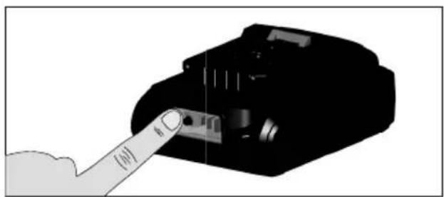 Illustration of a hand inserting a component into a device (no text or symbols visible)