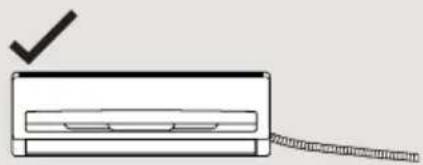 Simple line drawing of a device with a checkmark above it, no text or symbols present