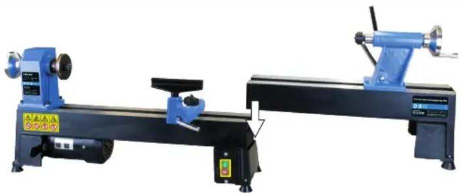 Two blue industrial cutting machines with warning labels and a directional arrow indicating assembly (no text or symbols on the machines themselves)