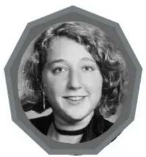 Black-and-white portrait of a smiling woman with curly hair, framed within an octagonal border (no text or symbols)