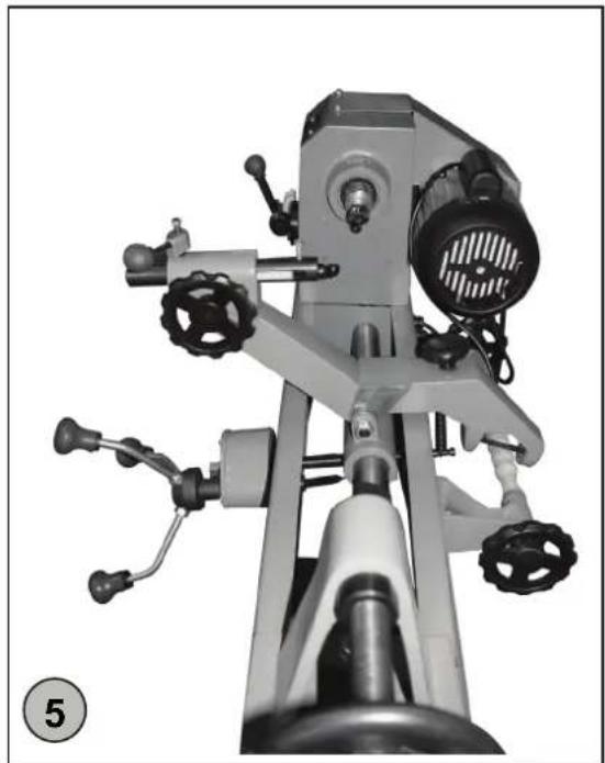 Mechanical device with articulated arms and control knobs, no visible text or symbols