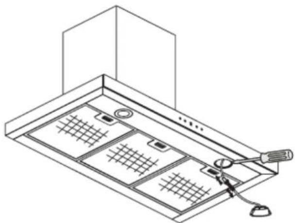 Line drawing of a kitchen air conditioner unit with ventilation grilles and a tool inserted (no text or symbols).