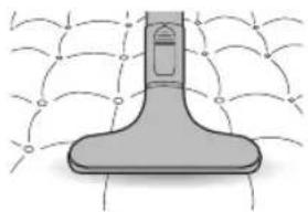 Diagram of a spray nozzle with fluid flow lines around it (no text or symbols)