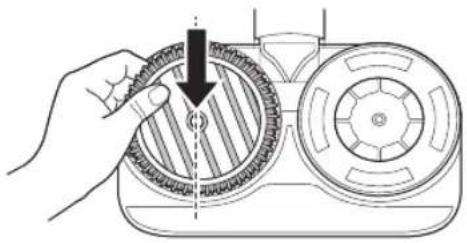 Diagram of a hand holding a gear-like component with a dashed arrow indicating rotation (no text or symbols present)